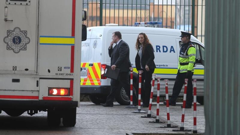 A Garda Van – escorted by detectives – is driven in to a secure area of Blanchardstown District Court. Photograph: Collins