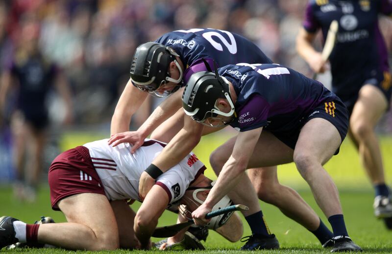 Wexford's Jack O'Connor and Cian Byrne tackle Daithí Burke of Galway at Wexford Park on May 4th. Photograph: Leah Scholes/Inpho