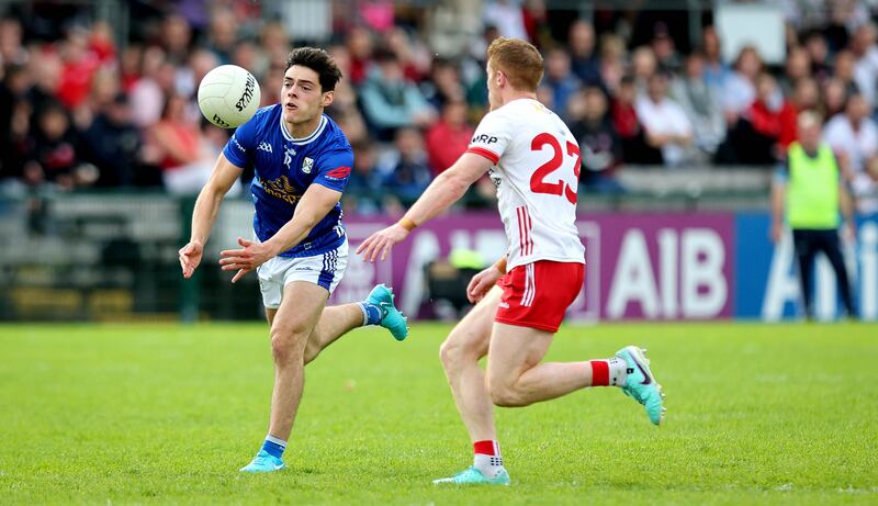 Tyrone’s Peter Harte and Oisin Brady of Cavan. Photograph: Ryan Byrne/Inpho