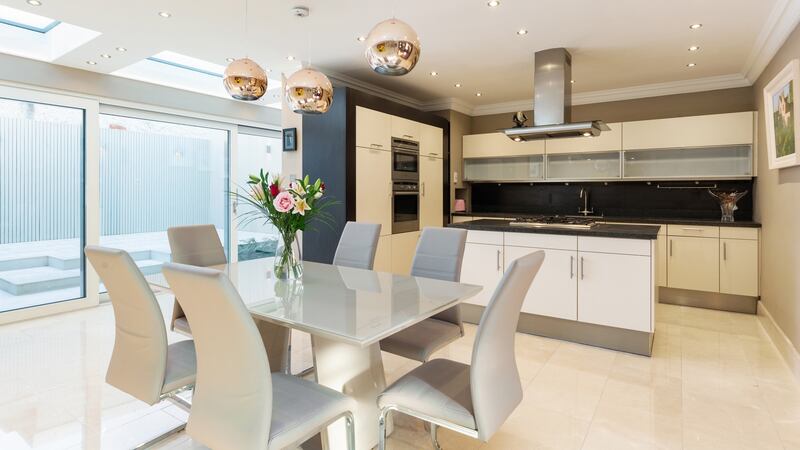 The kitchen features under-floor heating