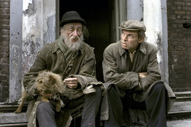 1979: Rashers Tierney (David Kelly) with his terrier dog Rusty and ‘Toucher’ Hennessy (Brendan Cauldwell) sit on the steps of a tenement house on Dublin’s Henrietta Street in the drama series Strumpet City. Photograph: Mary Lee/RTÉ