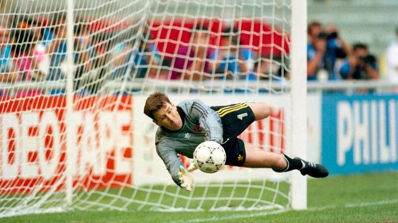 Packie Bonner saves Daniel Timofte’s penalty during the last 16 match against Romania. Photo: Billy Stickland/Inpho