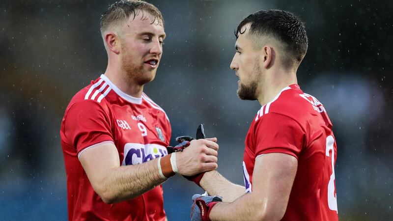 Killian O’Hanlon and Nathan Walsh celebrate Cork’s win over Limerick. Photograph: Laszlo Geczo/Inpho