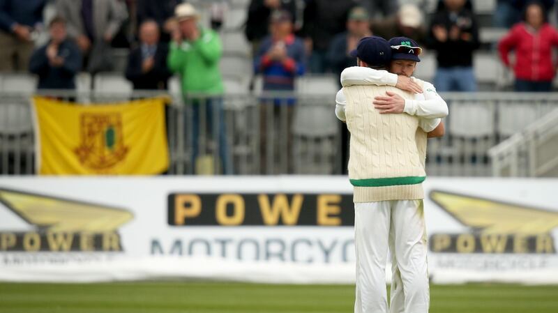 Ed Joyce hugs Stuart Thompson at the end of the Test match against Pakistan in Malahide. Photograph: Oisín Keniry/Inpho
