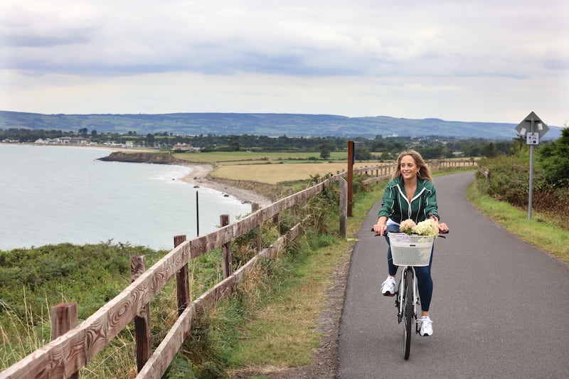Aisling Larkin cycling on the Greenway near her home