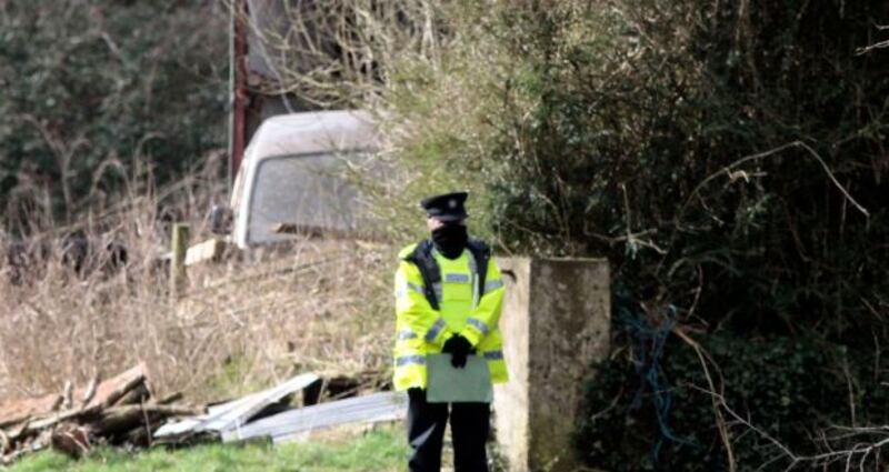 Garda at the farm near Curraghgorm, Co Cork, on Friday. The results of postmortems on the three men have not yet been released for operational reasons. Photograph: Brendan Gleeson/PA Wire