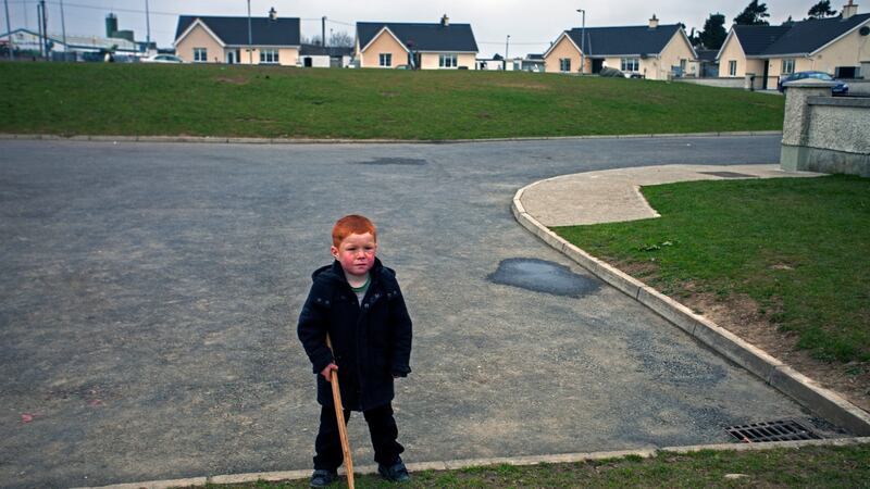 From the book of photographs The Republic: a Traveller child near his home at Hebron Road, Co Kilkenny, part of the exhibition of  Home is Another Place at the little Museum of Dublin. Photograph: Seamus Murphy