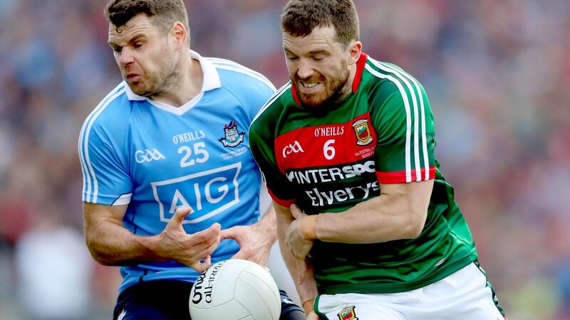 Mayo’s Chris Barrett challenges Dublin’s Kevin McManamon during the All-Ireland final. Photograph: James Crombie/Inpho