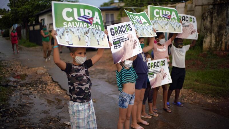 Cuban children in Havana  prepare to   welcome home  Cuban doctors from   their three-month  mission in Andorra to help  fight  coronavirus. Photograph:  Sven Creutzmann/Getty Images