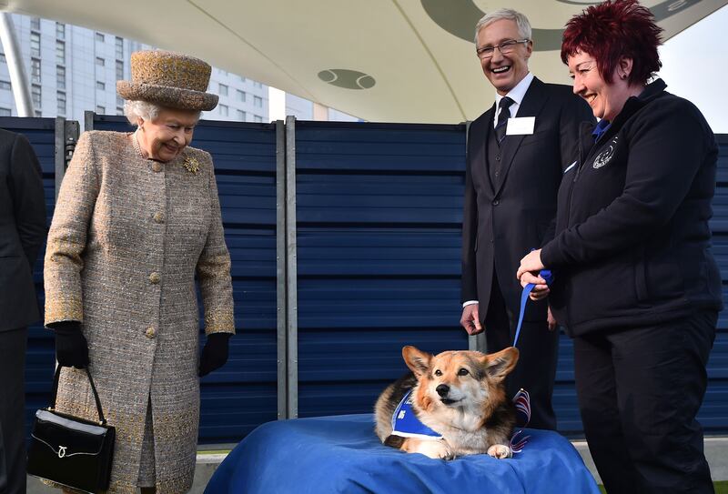 Queen Elizabeth II and Paul O'Grady during a visit to Battersea Dogs and Cats Home in London in 2015. Photograph: Ben Stansall/PA