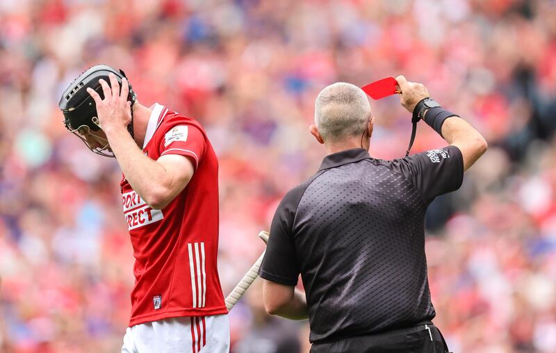 Cork's Eoin Downey sees red. Photograph: Inpho 