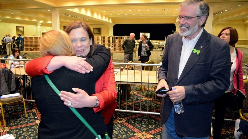 Mary-Lou McDonald greets a friend, watched by Sinn Féin leader Gerry Adams at the Dublin West byelection count in  City Wes Dublin. Photograph: Dave Meehan/The Irish Times