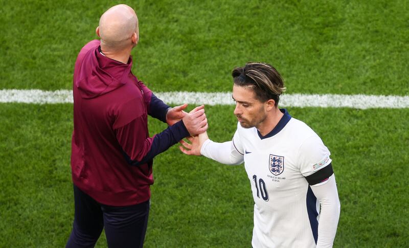 England's Jack Grealish with manager Lee Carsley as he leaves the pitch. Photograph: Bryan Keane/Inpho