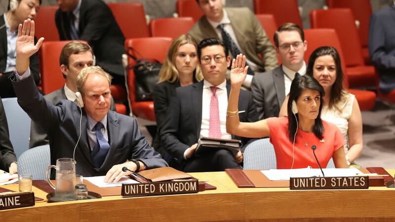 British Ambassador to the United Nations Matthew Rycroft and US Ambassador Nikki Haley vote during a Security Council meeting on  North Korea. Photograph: Mary Altaffer/AP