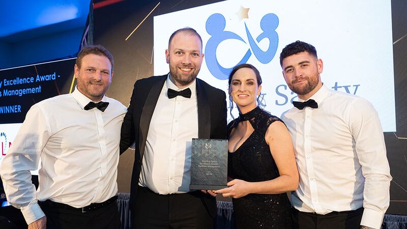 Padraic Geraghty, senior account executive at Skillko, presents the health & safety excellence award – facilities management to LMC FM team