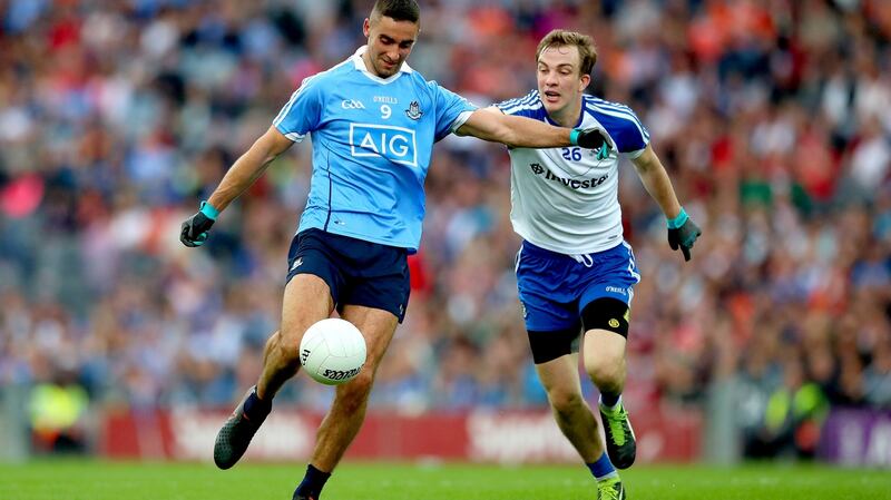 Dublin’s James McCarthy is closed down by Jack McCarron of Monaghan. Photograph: James Crombie/Inpho
