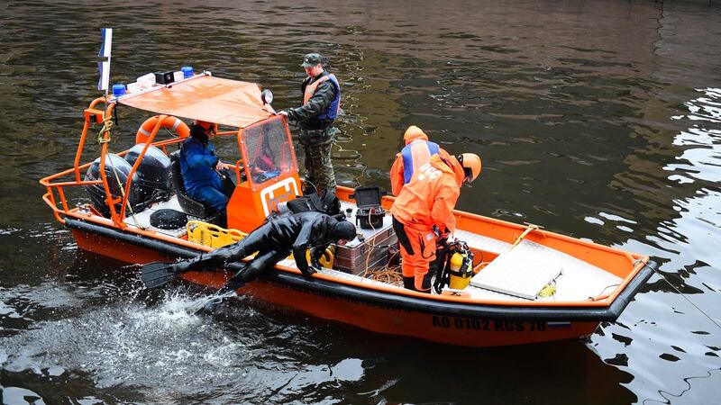 Russian emergency rescuers and police investigators conduct searches on the Moika river, in St Petersburg, following the killing of a woman that implicates historian Oleg Sokolov. Photograph: Olga Maltseva/AFP via Getty Images