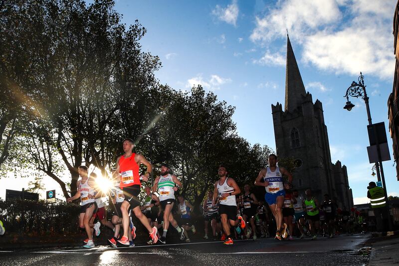 Runners pass St Patrick's Cathedral during the 2022 Irish Life Dublin Marathon. Photograph: Bryan Keane/Inpho