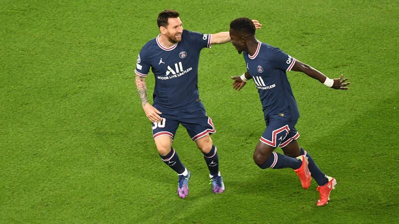 Paris Saint-Germain’s Idrissa Gueye celebrates opening the scoring against Man City with Lionel Messi. Photograph: Alain Jocard/Getty/AFP