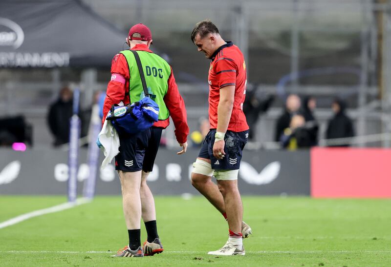 Munster's Brian Gleeson leaves the pitch due to an elbow injury during the game against Leinster. Photograph: Dan Sheridan/Inpho