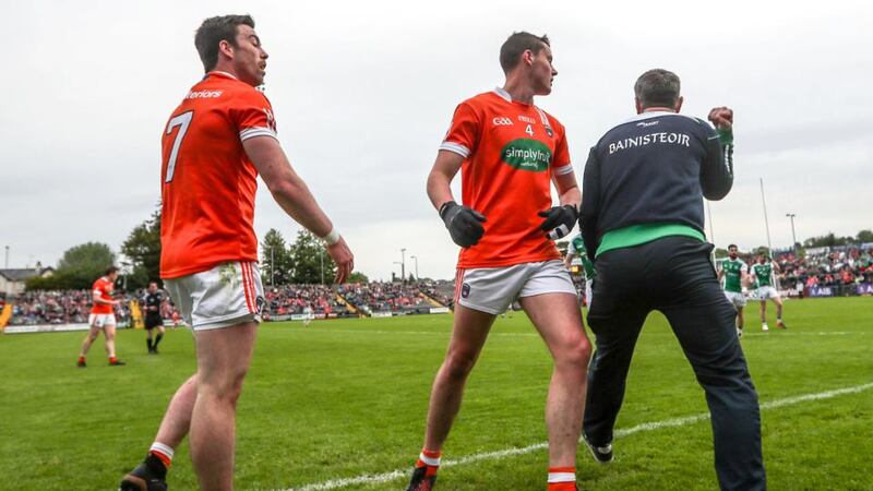 Fermanagh manager Rory Gallagher celebrates next to Armagh’s Aidan Forker and Aaron McKay. Photograph: James Crombie/Inpho