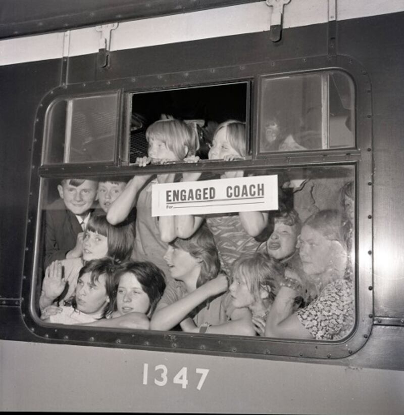 About 200 refugees from Belfast were moved by train from Gormanston Military Camp, Co Meath, to Tralee, Co, Kerry onAugust 12th, 1971. Photograph by Tommy Collins shows some of them at Heuston Station, Dublin, en route to Tralee. Photograph: Tommy Collins/The Irish Times
