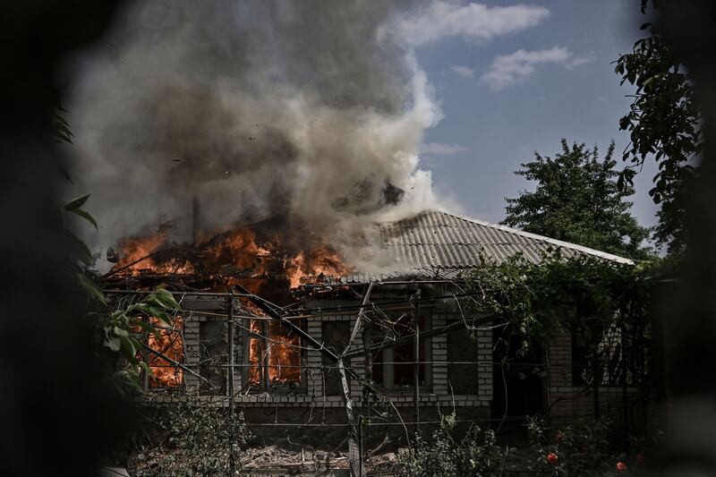 A house burns after being shelled during an artillery duel between Ukrainian and Russian troops in the city of Lysychansk, eastern Ukrainian region of Donbas. Photograph: Aris Messinis/AFP via Getty