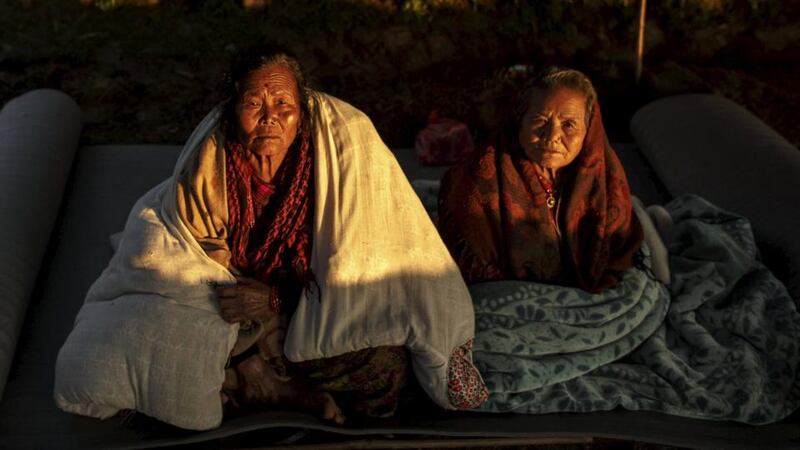 Earthquake: villagers in Paslang, near the epicentre, in Gorkha. Photograph: Athit Perawongmetha/Reuters