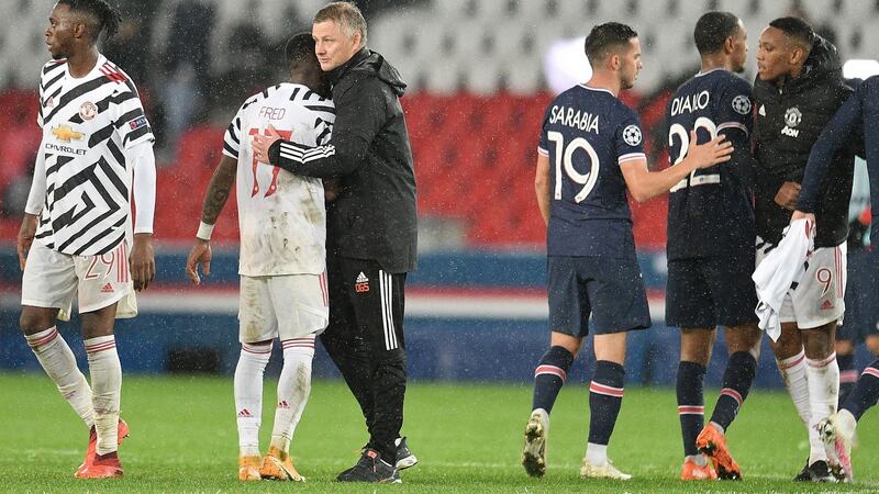 Ole Gunnar Solskjaer congratulates Fred following Man United’s win at the Parc des Princes. Photograph: PA