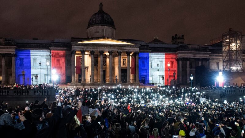 Hundreds of people attend a vigil for the victims of the Paris attacks in Trafalgar Square on Saturday night. Photograph: EPA/Will Oliver