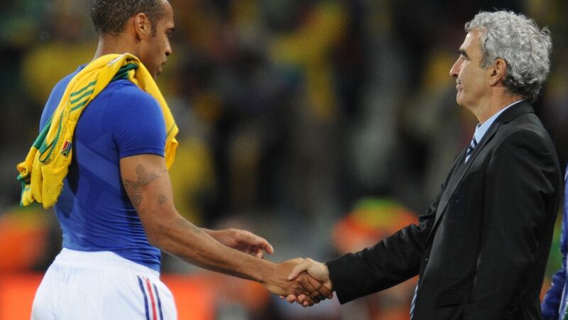 Thierry Henry shakes hands with  Raymond Domenech after France’s 2-1 defeat to South Africa. Photograph: Franck Fife/AFP/Getty