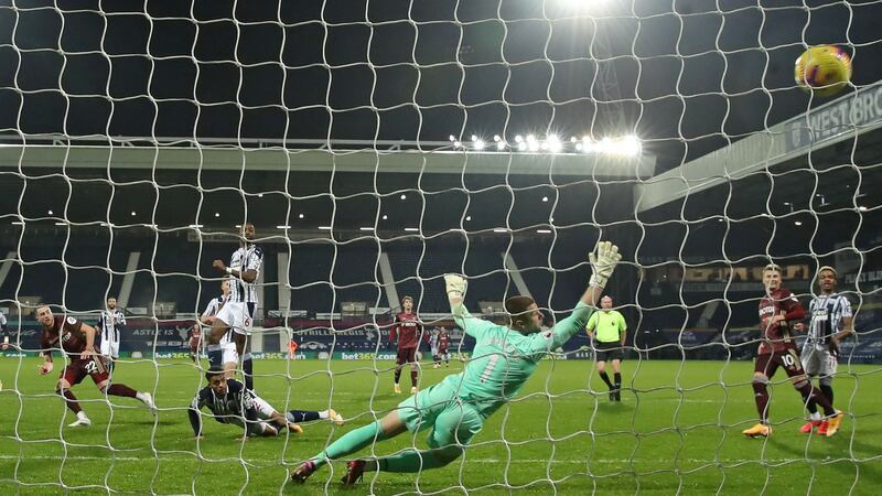 Jack Harrison (left) scores Leeds United’s third goal past West Brom goalkeeper Sam Johnston  during the  Premier League  match  at The Hawthorns. Photograph:  Dave Rogers/AFP via Getty Images