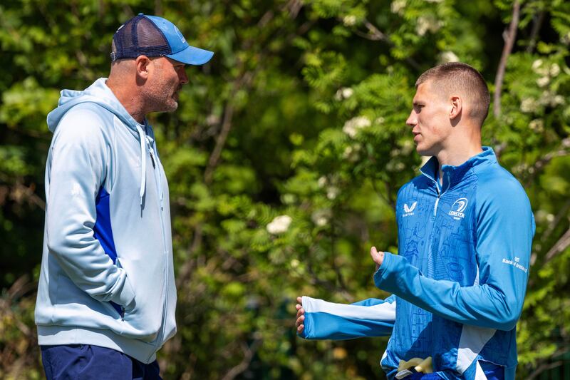 Leinster senior coach Jacques Nienaber with Sam Prendergast during squad training. Photograph: Tom Honan/Inpho