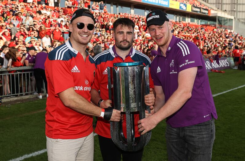 Munster’s Shane Daly, John Hodnett and Cian Hurley celebrate with the URC trophy. Photograph: Ben Brady/Inpho