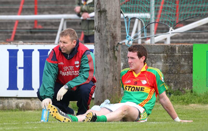Thomas Walsh watches the remainder of the game from the sideline after being sent off for two yellow cards in his comeback game for Carlow against Wicklow in 2010 in  Portlaoise. Wicklow won 3-13 to 0-12. Photograph: Lorraine O'Sullivan/Inpho 