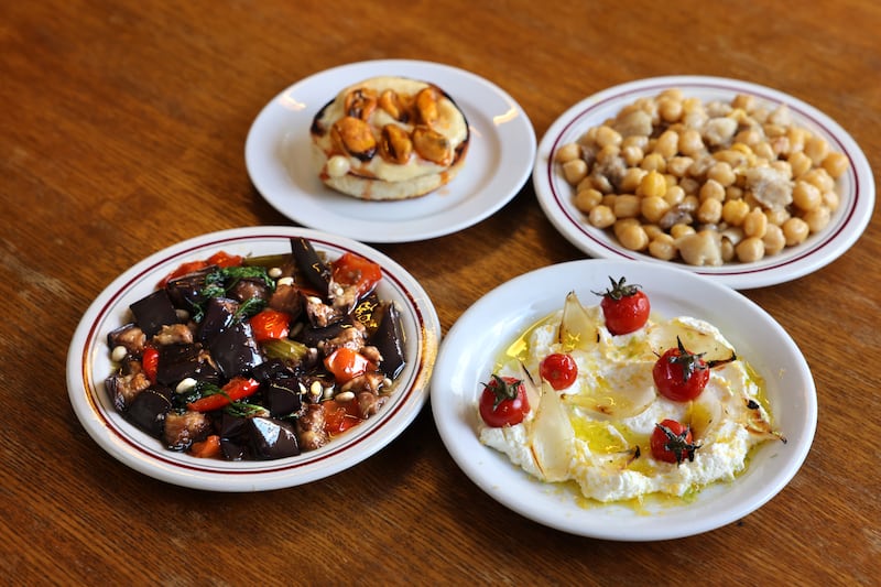 Small plates at Assassination Custard (clockwise from bottom left): Caponata; grilled brioche, mussels and aioli; chickpeas with confit pig; labneh, pickled tomatoes and bottarga. Photograph: Dara Mac Dónaill