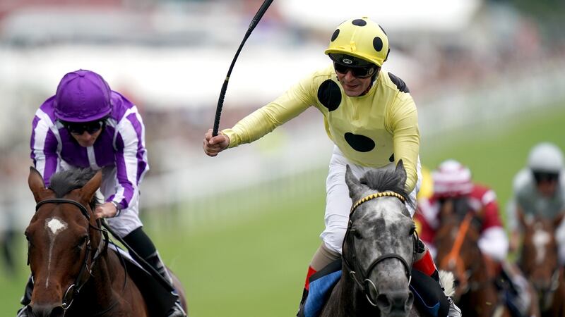 Andrea Atzeni (R) and Defoe take the Coronation Cup ahead of Ryan Moore and Kew Gardens. Photograph: John Walton/PA
