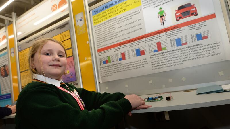 Lily Eyers, a first-year student at Killorglin Community College in Co Kerry, with her project Rear Guard, at the BT Young Scientist and Technology exhibition, in the RDS. Photograph: Dara Mac Dónaill