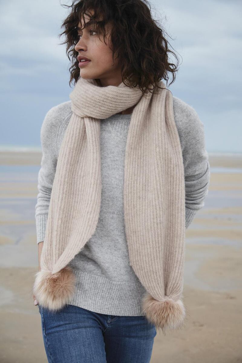 Cashmere sweatshirt jumper €155, pompom scarf €98, skinny jeans €116