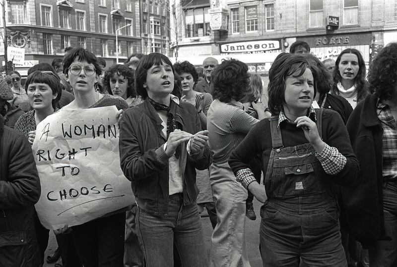  Pictured among choice supporters at the first Women’s Right to Choose protest on May 12th, 1979, is poet Mary Dorcey (clapping) and activist Marian O’Keeffe in the foreground. Photograph: Derek Speirs