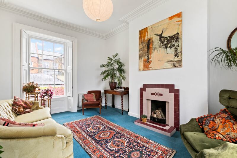 This is one of the two bedrooms at hall level and has been laid out as a second reception room.