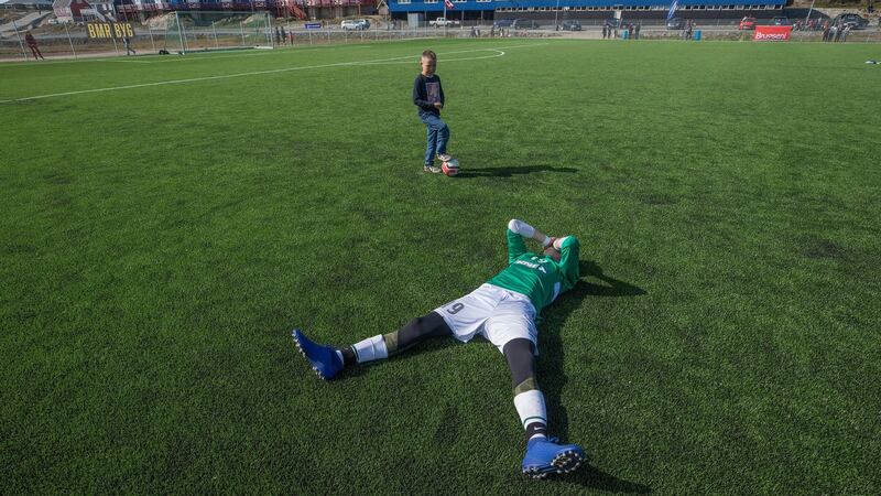 Patrick Larsen of N-48 is overcome with emotion after his team beat favourites B-67, known as Greenland’s Real Madrid, to advance to the final. Photograph: Kieran Dodds/New York Times