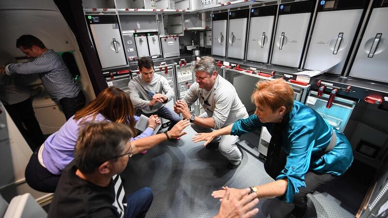 Passangers and crew exercising on the non-stop test flight from New York to Sydney. Photograph: Qantas/AFP/Getty Images.