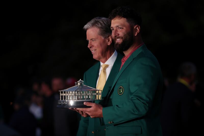 The 2023 winner, Jon Rahm of Spain, poses with the Masters trophy and Augusta National chairman Fred Ridley during the Green Jacket Ceremony. Photograph: Patrick Smith/Getty Images