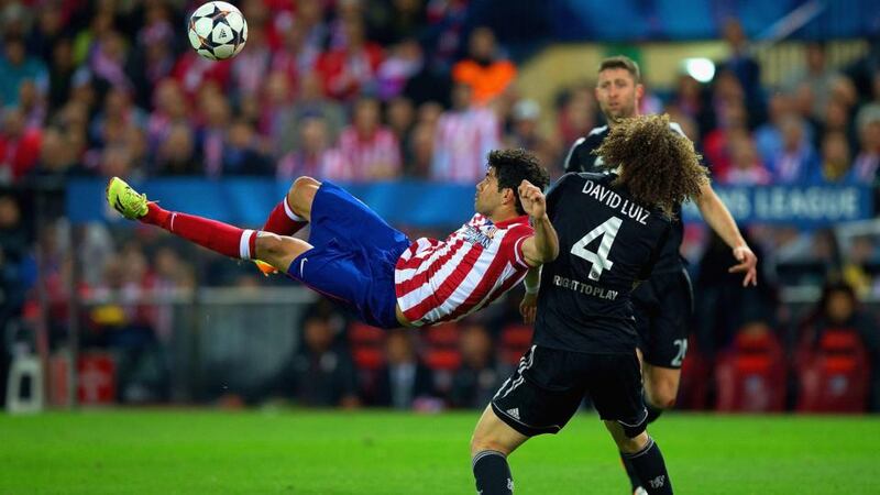 Diego Costa of Atletico  Madrid attempts an overhead kick while under pressure from David Luiz of Chelsea  at Vicente Calderon Stadium. Photograph:  Gonzalo Arroyo Moreno/Getty Images