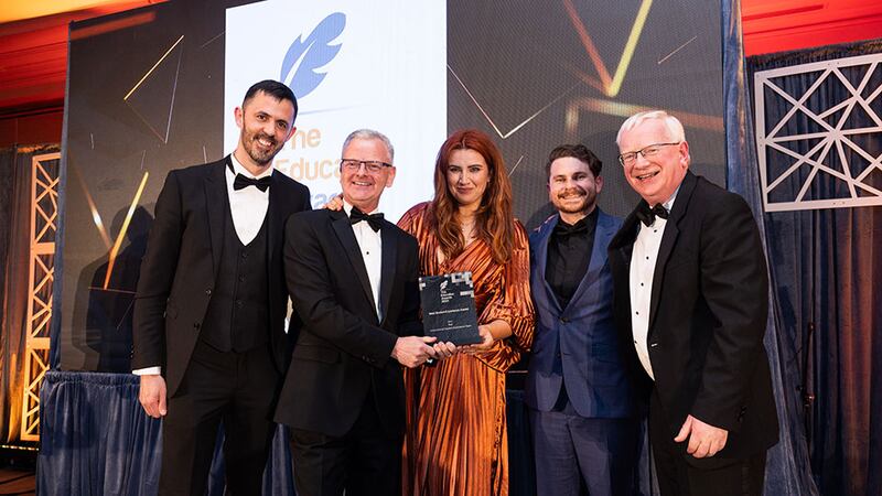 Dr Ciarán Ó Hannracháin, awards judge, presents the best student experience award to the TUS team