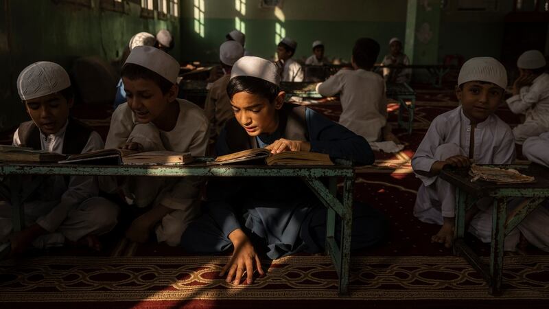 Young students read their lessons at a madrasa  in Jalalabad. Photograph: Victor J Blue/The New York Times