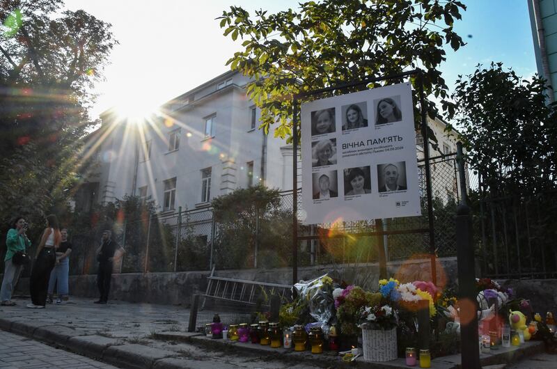 Ukrainians lay flowers at the site of a Russian strike that hit a residential area in Lviv on Wednesday. Photograph: Mykola Tys/EPA