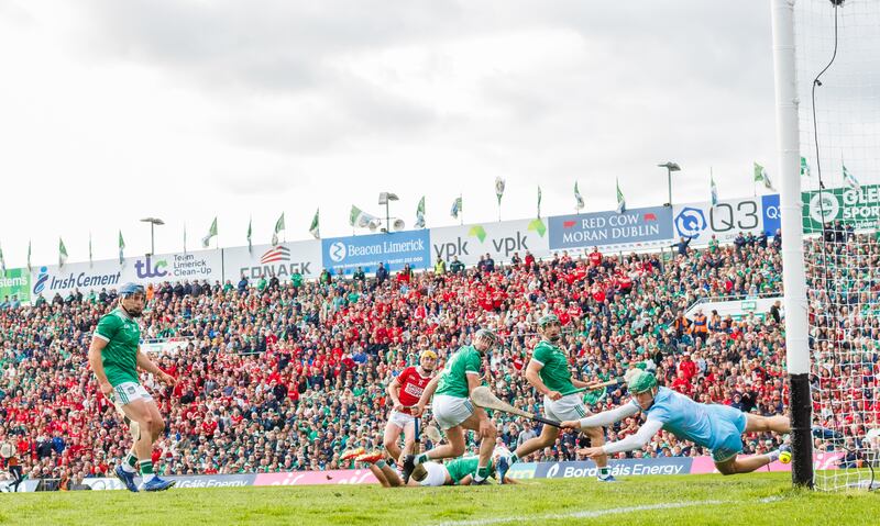 Cork’s Shane Barrett scored despite efforts by Limerick goalkeeper Nickie Quaid. Photograph: James Crombie/Inpho