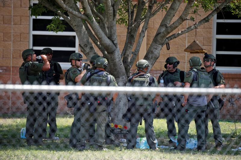 Police outside Robb Elementary School in Texas where 21 people were killed. Photograph: Dario Lopez-Mills/AP